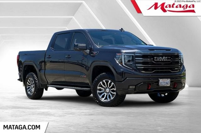 2023 GMC Sierra 1500 AT4 in Titanium Rush Metallic — front three-quarter view