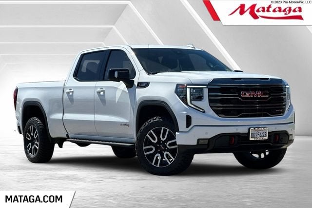 2023 GMC Sierra 1500 AT4 in Summit White — front three-quarter view